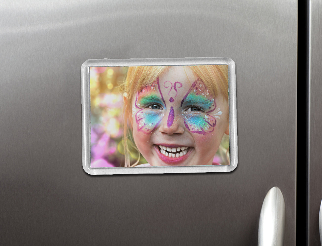 Acrylic Photo Magnet with kids picture, positioned on fridge.