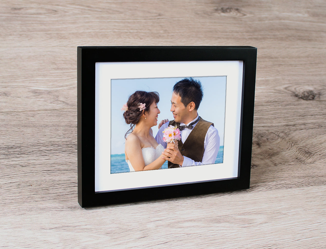 Framed Photo of couple with thick black frame and white mat board