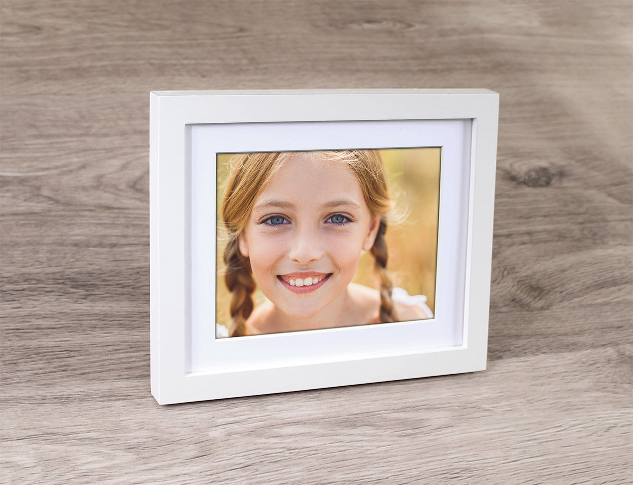 Framed Photo of girl, with thick white frame and white mat board