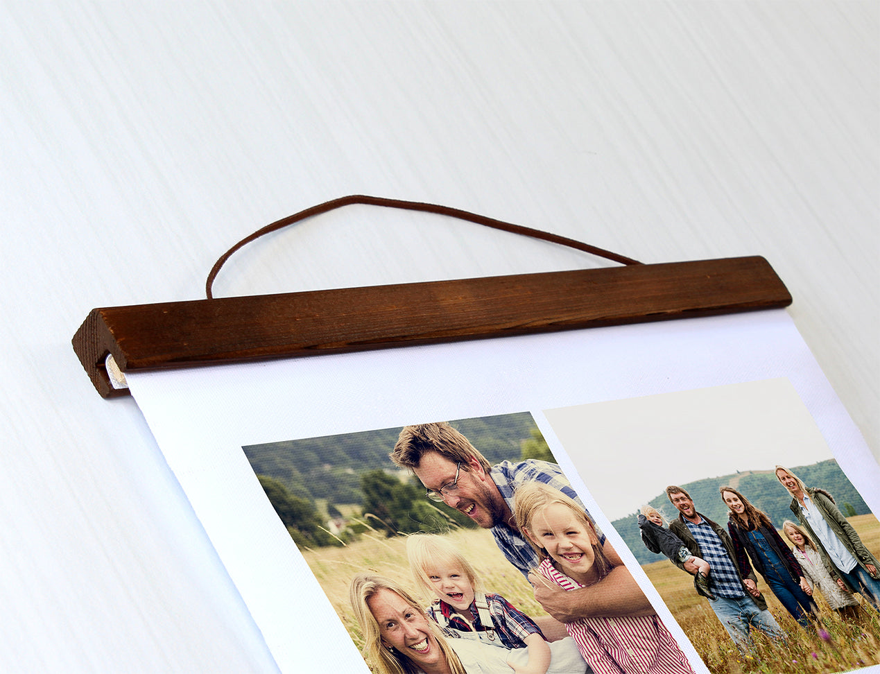 Close-up of Hanging Canvas, showing brown wooden bar and string for hanging