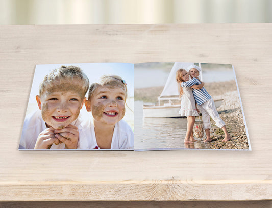 Mini Photo Book with images of kids displayed on table