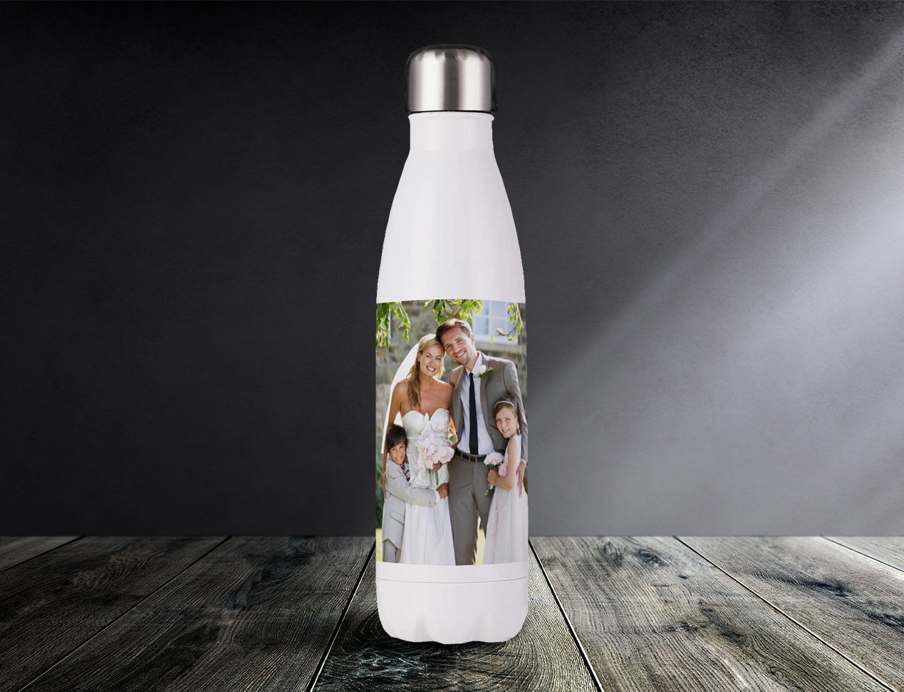 Personalised Water Bottles - customised with wedding photo is standing on a table.